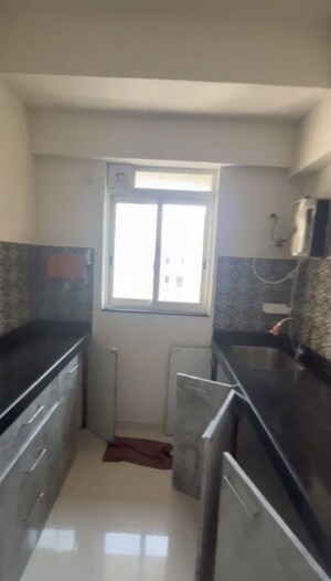 Kitchen in 1 BHK Apartment at Lodha Amara, Kolshet Road – for Sale
