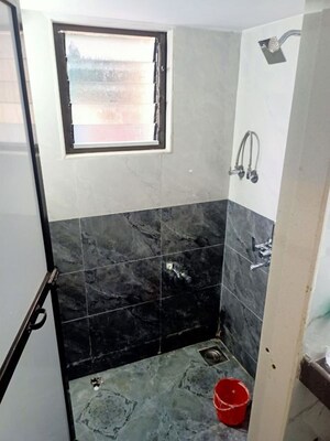 Bathroom in 1 BHK Apartment at Nagari Niwara CHS, Goregaon East – for Rent