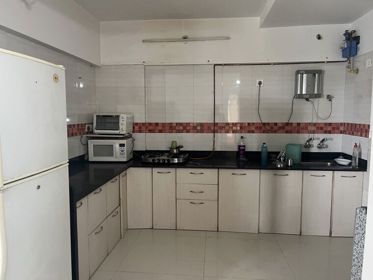 Kitchen, uttam-townscapes 2 Bedroom 1100 Sq.Ft. Apartment In Yerawada Pune 10486886