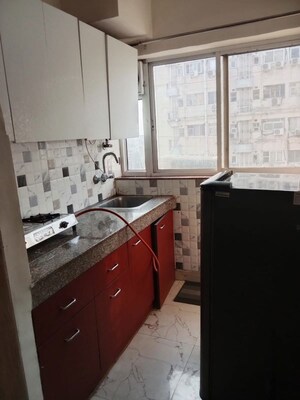 Kitchen in Studio Apartment at DLF Capital Greens Phase I And II, Moti Nagar – for Rent