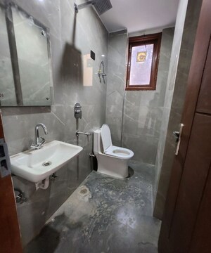 Bathroom in 1 BHK Builder Floor at Freedom Fighters Enclave – for Rent