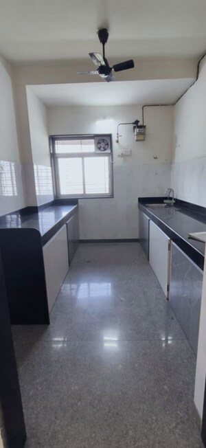 Kitchen in 2 BHK Apartment at Kalpataru Hills Phase II, Manpada – for Sale