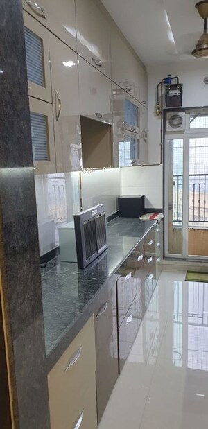 Kitchen in 3 BHK Apartment at Rustomjee Azziano Wing I, Thane West – for Sale