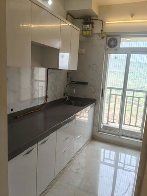 Kitchen in 2 BHK Apartment at Vihang Vermont, Ghodbunder Road – for Rent