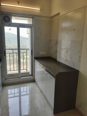 Kitchen in 2 BHK Apartment at Vihang Vermont, Ghodbunder Road – for Rent