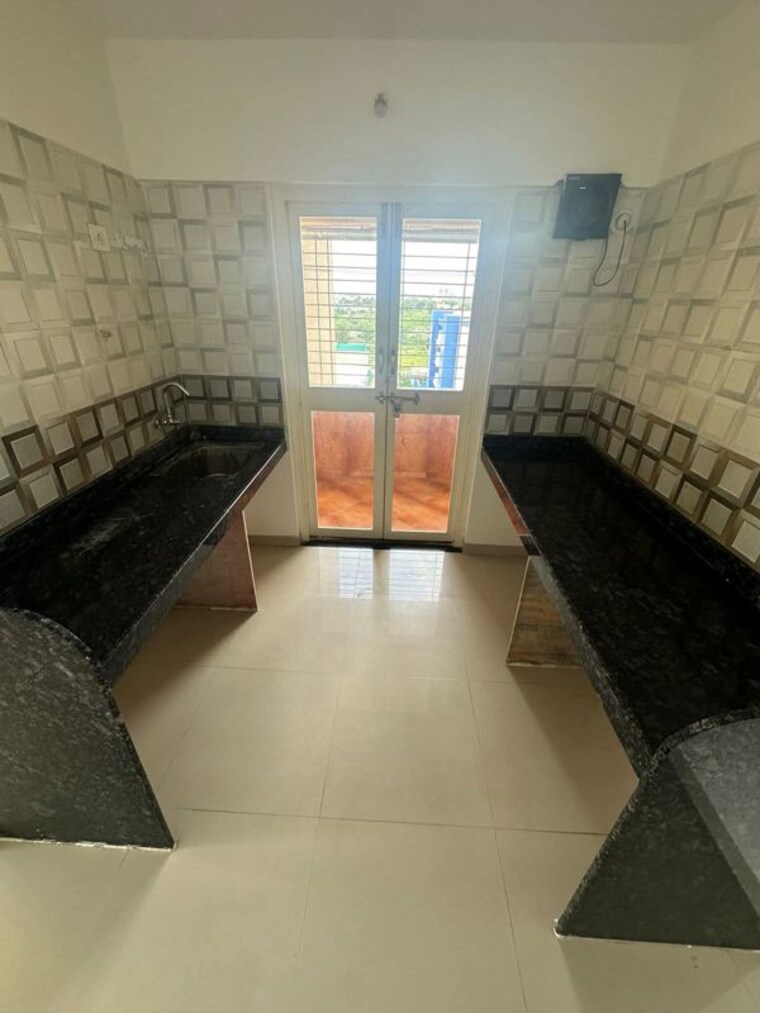 Kitchen, bramha-sky-one 2.5 Bedroom 1100 Sq.Ft. Apartment In Undri Pune 10489432