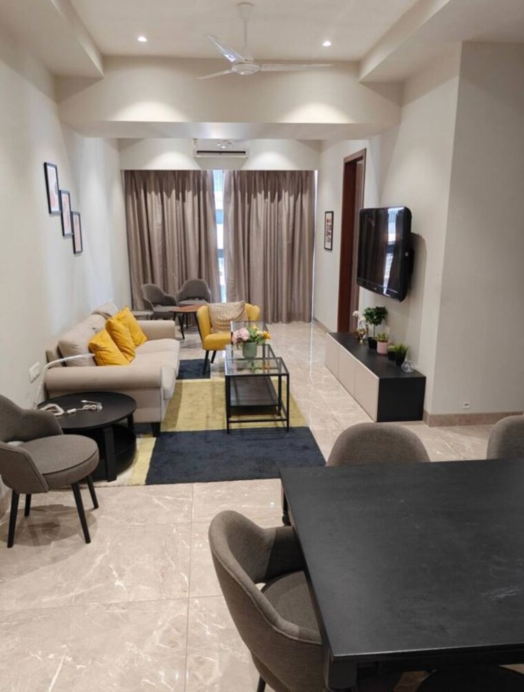 Living Room, romell-umiya-grandeur 2 Bedroom 822 Sq.Ft. Apartment In Goregaon East Mumbai 10490508