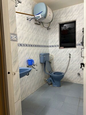Bathroom in 2 BHK Apartment at Amrut Runwal Daffodils, Nibm – for Rent