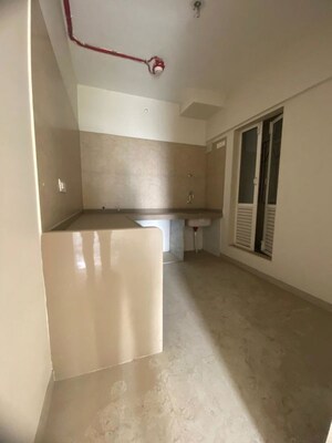 Kitchen in 2 BHK Apartment at Dosti West County, Balkum Pada – for Sale