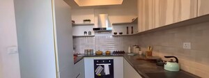 Kitchen in 4 BHK Apartment at Godrej Nest, Sector 150 – for Sale