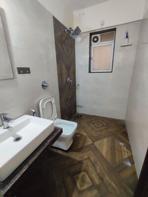 Bathroom in 2 BHK Apartment at Shree Tirupati STG Signature Residency, Patlipada – for Rent