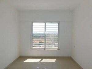 Room in 2 BHK Apartment at Kolte Patil Little Earth, Kiwale – for Rent