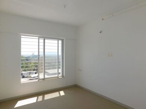 Room in 2 BHK Apartment at Kolte Patil Little Earth, Kiwale – for Rent