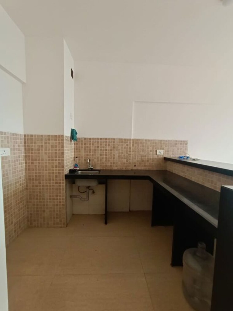 Kitchen, lodha-belmondo 1 Bedroom 900 Sq.Ft. Apartment In Gahunje Pune 10492876