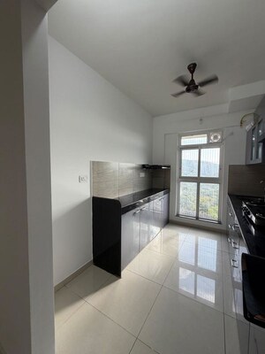 Kitchen in 3 BHK Apartment at Godrej Emerald, Ghodbunder Road – for Rent