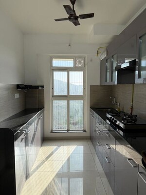 Kitchen in 3 BHK Apartment at Godrej Emerald, Ghodbunder Road – for Rent