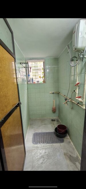 Bathroom in 2 BHK Apartment at Evershine CHS Malad, Malad West – for Rent
