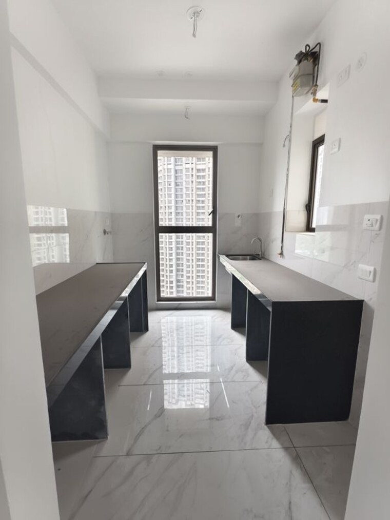 Kitchen, raymond-ten-x-habitat 2 Bedroom 670 Sq.Ft. Apartment In Pokhran Road No Two Thane 10493467