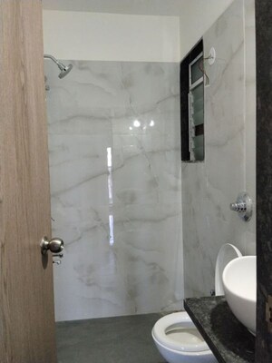 Bathroom in 1 BHK Apartment at Anant Metropolis Insignia Towers, Kasarvadavali – for Rent