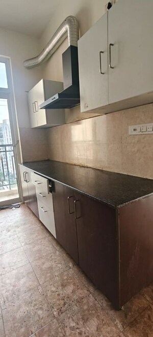 Kitchen in 2 BHK Apartment at Ansals Celebrity Greens, Sushant Golf City – for Rent