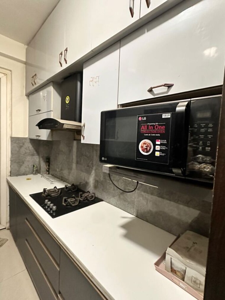 Kitchen, amrapali-zodiac 3 Bedroom 1550 Sq.Ft. Apartment In Sector 120 Noida 10494307