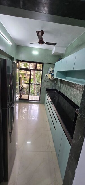 Kitchen in 2 BHK Apartment at Rukhmini CHS, Andheri West – for Rent