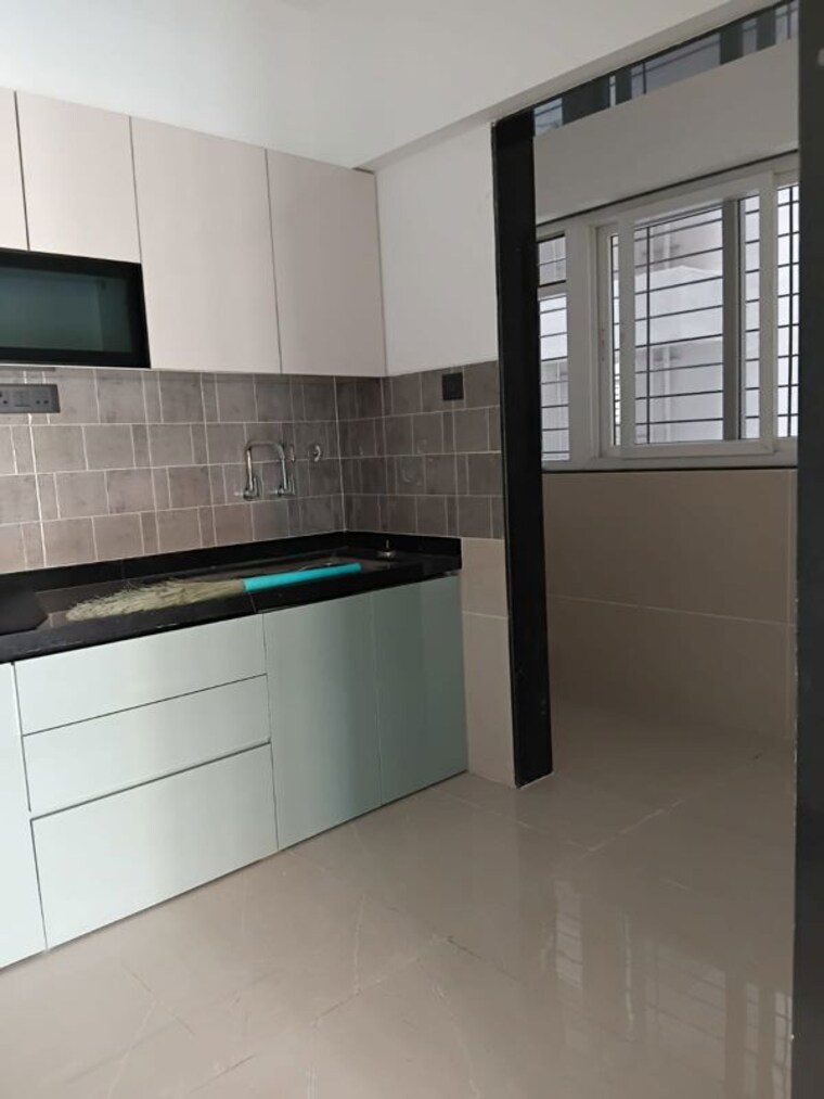 Kitchen, nyati-elysia 2 Bedroom 850 Sq.Ft. Apartment In Kharadi Pune 10496371