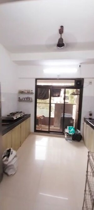 Kitchen in 3 BHK Apartment at Neo Vikram CHS, Andheri West – for Rent