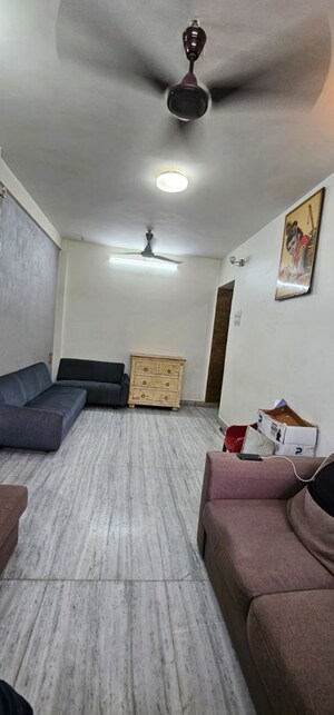 Living Room in 2 BHK Apartment at Sunder Jamnotri CHS, Malad West – for Rent