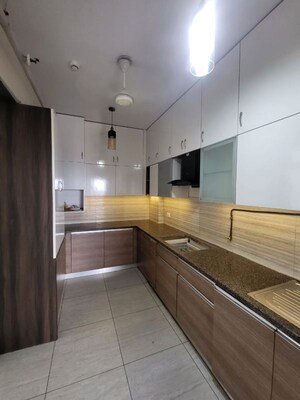Kitchen in 3 BHK Apartment at ABA Cleo County, Sector 121 – for Rent