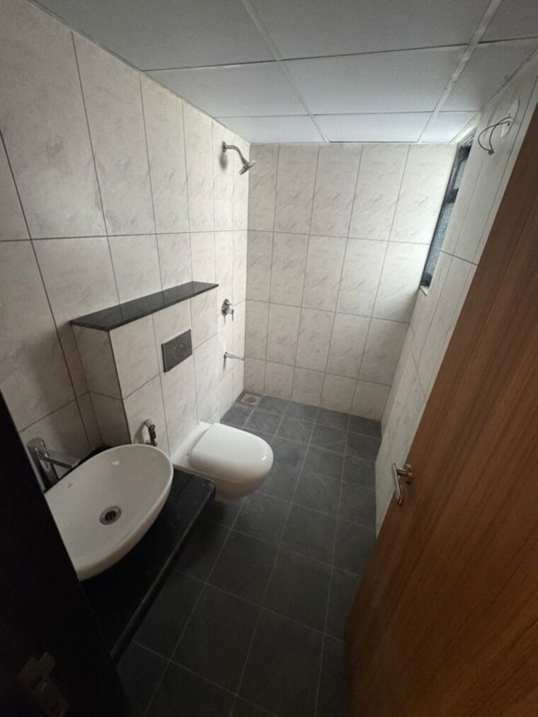 Bathroom, gera-planet-of-joy 2 Bedroom 800 Sq.Ft. Apartment In Kharadi Pune 10497405
