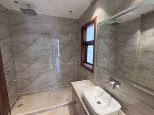 Bathroom in 4 BHK Apartment at Vasant Vihar – for Rent