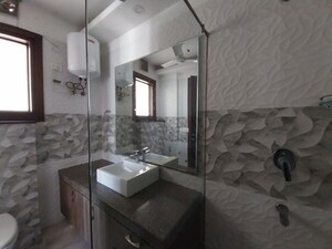 Bathroom in 4 BHK Apartment at Vasant Vihar – for Rent