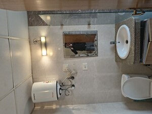 Bathroom in Studio Apartment at Nimbus The Golden Palm, Sector 168 – for Rent