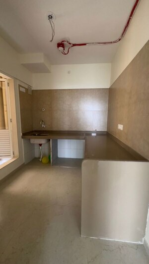 Kitchen in 2 BHK Apartment at Dosti West County, Balkum Pada – for Rent