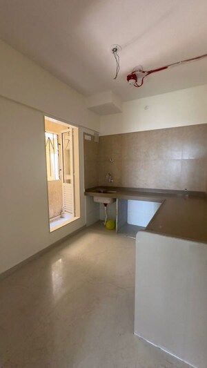Kitchen in 2 BHK Apartment at Dosti West County, Balkum Pada – for Rent