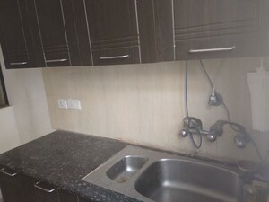Kitchen in 2.5 BHK Apartment at Prateek Wisteria, Sector 77 – for Rent