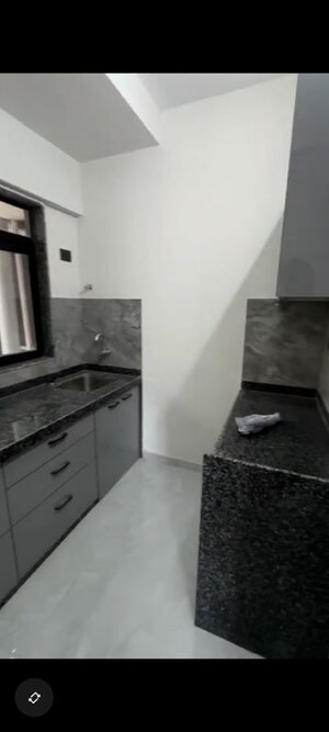 Kitchen in 2 BHK Apartment at Adarsh CHS Oshiwara, Oshiwara – for Rent