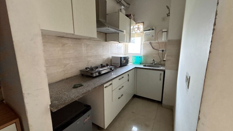 Kitchen, ajnara-daffodil 1 Bedroom 555 Sq.Ft. Apartment In Sector 137 Noida 10501357