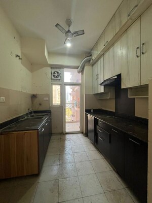 Kitchen in 4 BHK Apartment at Mahagun Moderne, Sector 78 – for Rent