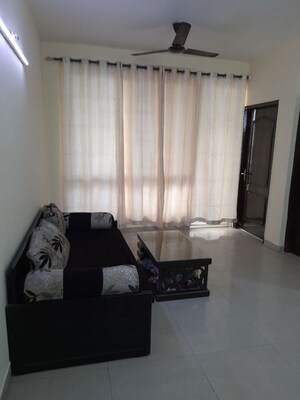 Living Room in 1 BHK Apartment at Sikka Karmic Greens, Sector 78 – for Rent