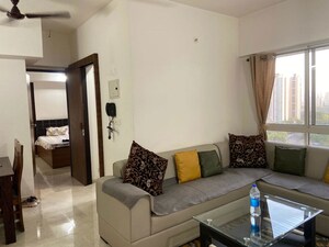 Living Room in 2 BHK Apartment at Lodha Amara, Kolshet Road – for Rent