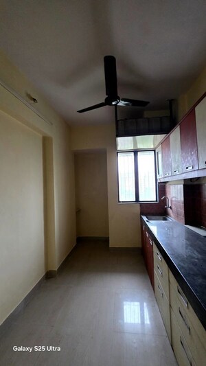 Kitchen in 1 BHK Apartment at Kavya Hill View CHS, Anand Nagar – for Sale
