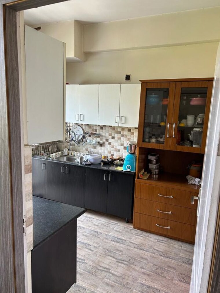 Kitchen, ansal-api-celebrity-gardens 2 Bedroom 1320 Sq.Ft. Apartment In Sushant Golf City Lucknow 10503564