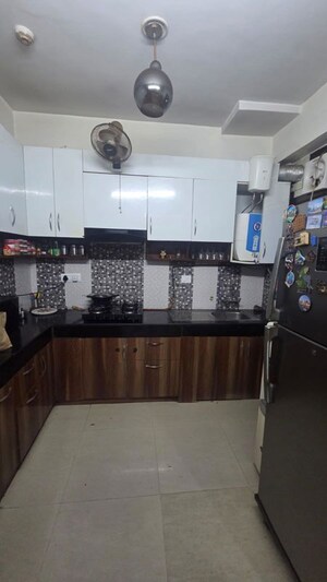 Kitchen in 2 BHK Apartment at Niho Saffron Scottish Garden, Ahinsa Khand 2 – for Sale