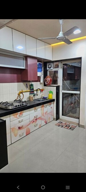 Kitchen in 2 BHK Apartment at Godrej Garden City Carmel, Jagatpur – for Rent