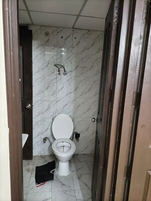 Bathroom in 2 BHK Apartment at Charms Castle, Raj Nagar Extension – for Rent