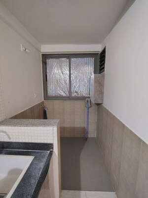 Kitchen in 2 BHK Apartment at Chetak Radhe Madhav, Sanand – for Rent