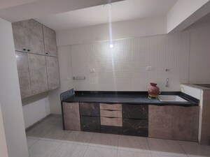 Kitchen in 2 BHK Apartment at Chetak Radhe Madhav, Sanand – for Rent
