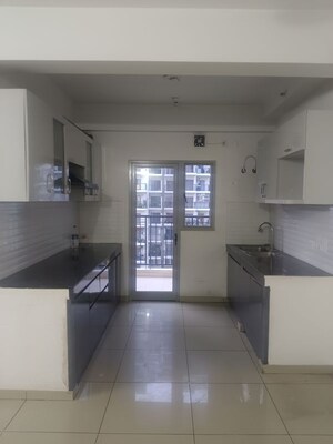 Kitchen in 3 BHK Apartment at Gulshan Bellina, Sector 16 Greater Noida – for Rent